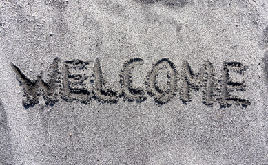 Business hello and welcome concept. Concept word Welcome written on beautiful ocean sand beach....