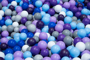 Purple blue and grey plastic balls.