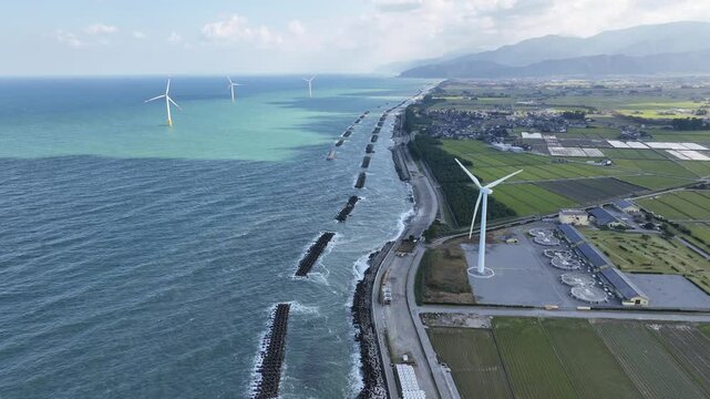 Toyama Prefecture in autumn, the offshore breakwater and offshore wind turbines seen from the Sea of ​​Japan coast.