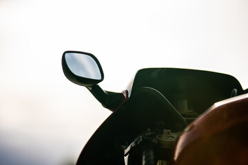 Mirror of a red fast motorcycle.