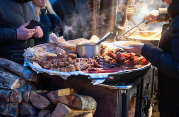  sausage on the grill in the city center at the Christmas market in Riga Latvia