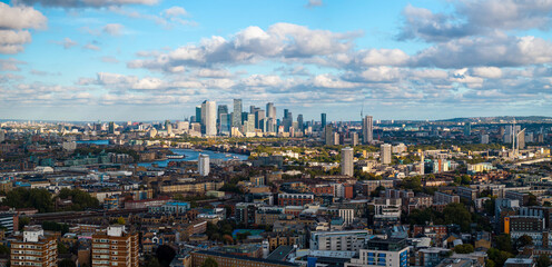 Fototapeta premium Panoramic aerial image of London cityscape with Canary Wharf skyline on the background. 