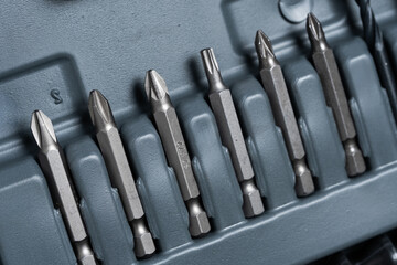 Fototapeta premium Set of screwdriver heads in a box, closeup.