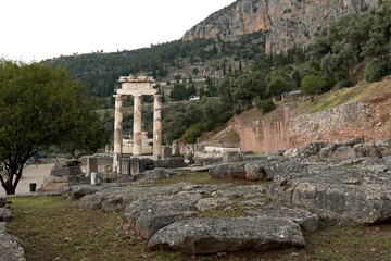Ruins of the ancient sacred precinct of Delphi. The Tholos in the sanctuary of Athena Pronaea....