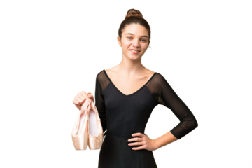 Teenager girl practicing ballet over isolated chroma key background posing with arms at hip and smiling