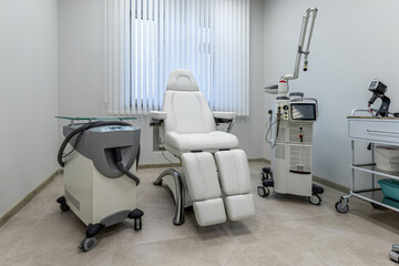 Modern Medical Treatment Room with Laser Equipment and Comfortable Chair