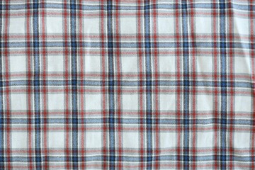 Red and Grey Checkered Fabric Background Texture. Cloth, tapestry or plaid with lot of folds