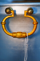 a string with a baptismal cross on the handle of the baptismal font. attributes of the baptism...