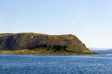 Norwegian fjord, with bright blue sky and the typical mountains of the North Cape 