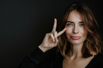 Obraz premium A person forming the universal symbol of peacefulness and unity