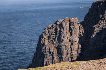 Norwegian fjord, with bright blue sky and the typical mountains of the North Cape 