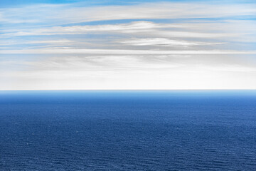Norwegian fjord, with bright blue sky and the typical mountains of the North Cape 