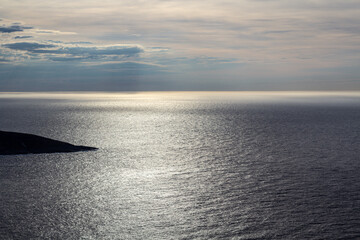 Norwegian fjord, with bright blue sky and the typical mountains of the North Cape 