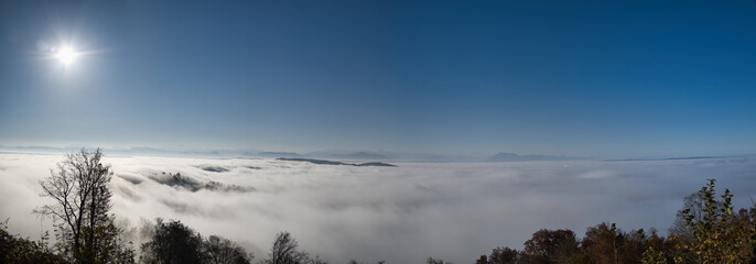 Fototapeta premium Panorama of the sea of ​​fog on the Uetliberg with blue sky in autumn