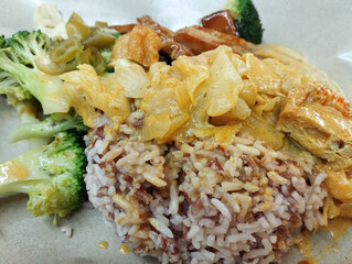 mixed vegetarian dish with fish curry sauce