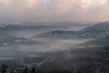 Early morning winter fog enshrouds the valley of Ein Kerem on the outskirts of Jerusalem, Israel.