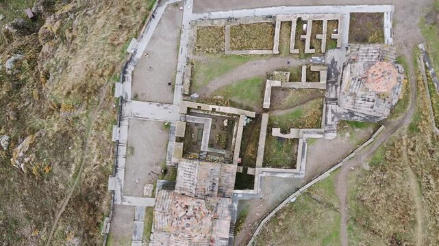 Aerial top circular view Sevanavank monastic complex. Peninsula northwestern shore of Lake Sevan in the Gegharkunik Province of Armenia. Group of tourist visit popular travel sightseeing attraction