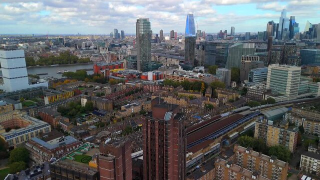 Aerial video of London skyline showing a train approaching Waterloo east. 