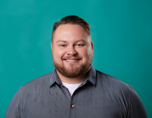 Portrait of Handsome Mature Man Looking Happy and Smiling Against Colored Studio Background