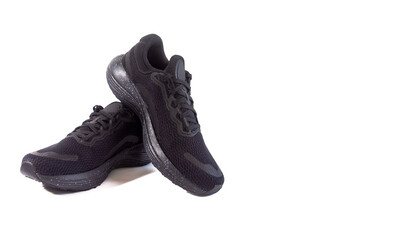 Unbranded black sports shoes photographed isolated on a white background