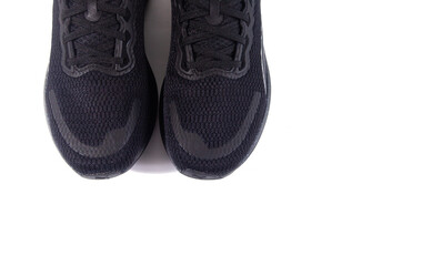 Unbranded black sports shoes photographed isolated on a white background