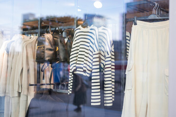 Women's clothing blouse on hangers in a store on shelves in a shopping center.