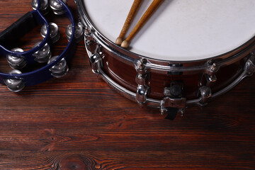 Different drums on a black background, percussion musical instruments
