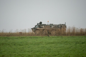 Fototapeta premium British army Patria Pasi Fuchs (Falcon Squadron) armoured 6x6 vehicle on a military exercise, Wiltshire UK