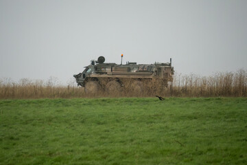 Naklejka premium British army Patria Pasi Fuchs (Falcon Squadron) armoured 6x6 vehicle on a military exercise, Wiltshire UK