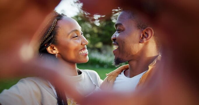 Hand, black couple and heart sign with kiss outdoor of healthy relationship, commitment and romance trust. People, love icon and bonding together with loyalty, care and save the date of marriage news
