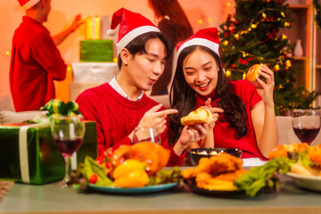 An upbeat New Year’s Eve celebration with Asian friends, family, colleagues, blending work and holiday vibes.while table brims with champagne, wine, gift boxes, delicious foods grilled chicken