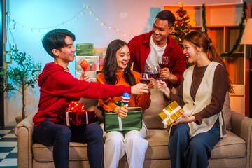 Lively Friday night New Year party with Asian friends, middle-aged and young adults, celebrating with champagne, wine, gifts, and food. A cozy, festive indoor gathering filled with joy and cheer.