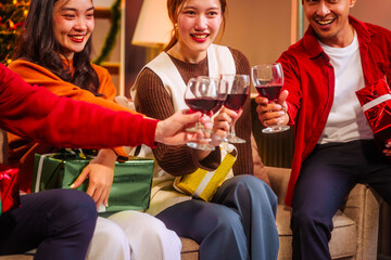 Lively Friday night New Year party with Asian friends, middle-aged and young adults, celebrating with champagne, wine, gifts, and food. A cozy, festive indoor gathering filled with joy and cheer.