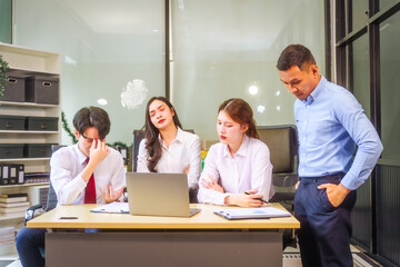 Two men and two women, including boss and employees, discuss recent mistake. Expressions of...