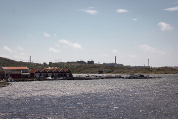 scissor islands off sm&ouml;gen in sweden, with bright sunshine and small white clouds