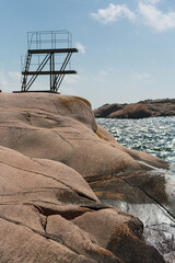 Rock formation at the Sm&ouml;gen bathing beach with the rustic diving platform
