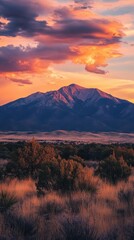 Fototapeta premium A tranquil sunset casts warm hues over the Sangre de Cristo mountains in New Mexico, showcasing nature's beauty at dusk