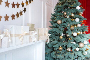 Festive Christmas tree adorned with decorations and gifts by the fireplace