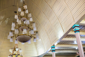 Decoration lights. Electric lamps hanging from the ceiling of a building