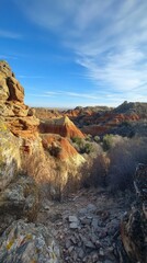 Obraz premium Explore the vibrant and captivating Painted Canyon under a clear blue sky during the tranquil afternoon hours