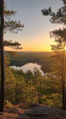 Fototapeta premium Breathtaking sunset over the tranquil lake in the Northwoods region surrounded by lush trees and vast wilderness