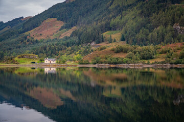 Fototapeta premium Autumn in Scotland with reflections in the lochs