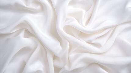 Obraz premium Elegant white silk fabric draped smoothly creating a luxurious and dreamy textured background for various creative projects