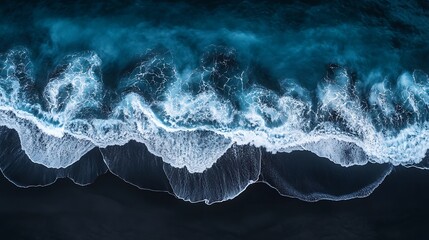 Fototapeta premium Aerial view of a black sand beach with crashing, Beautiful beach background