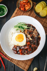 fried eggs with bacon and vegetables