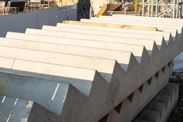 close-up view of stacked precast concrete stair elements at a construction site