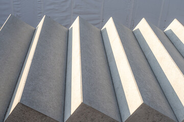 close-up view of stacked precast concrete stair elements at a construction site