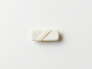 Minimalistic white soap on a plain white background, simple and clean composition with an emphasis on hygiene and simplicity.