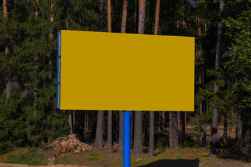 Advertising billboard along the road in the city on a winter day. Background for design. 