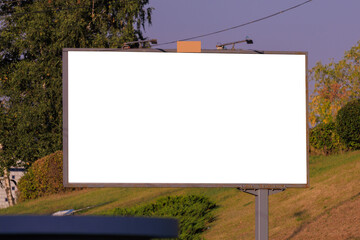 White billboard along the highway. Background for design and advertising. 